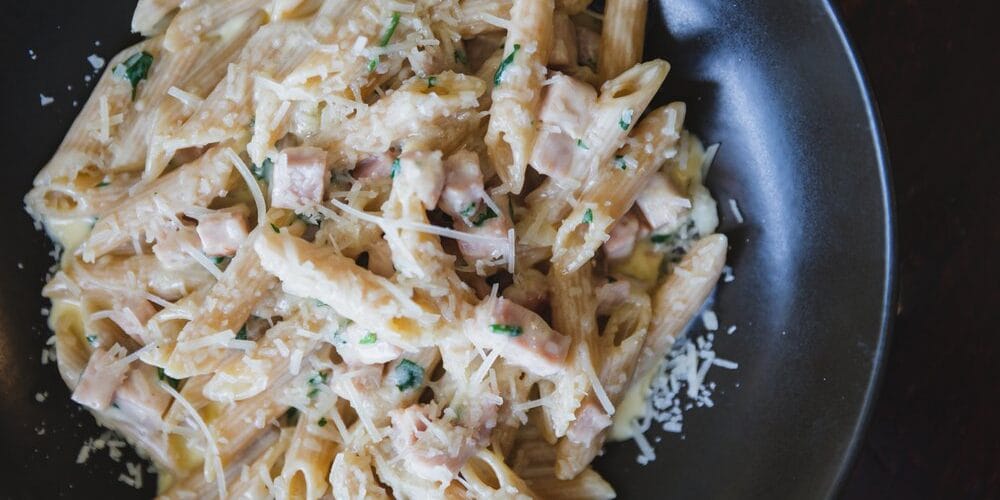 Wholemeal Penne De Cecco “alla Valdostana” with fontina cheese and prosciutto cotto