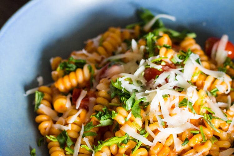 Artisan fusilli De Cecco with cherry tomatoes, rocket and goat “Capretto” cheese from Sardinia