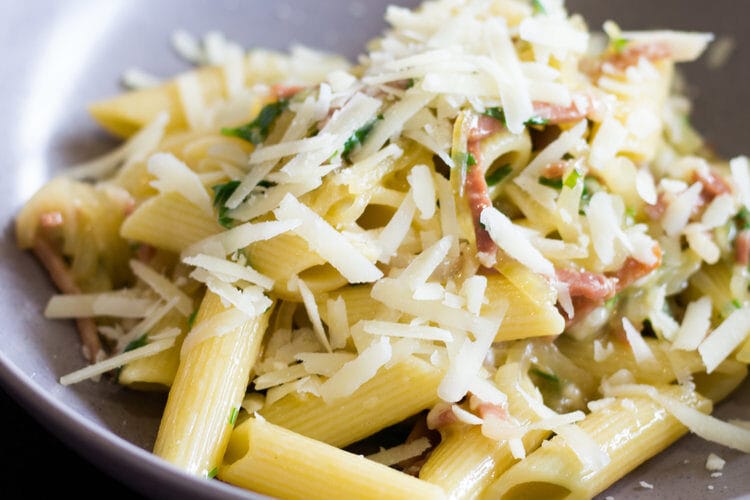 Pennoni Rigati De Cecco with Prosciutto, wine braised onion and Pecorino Romano