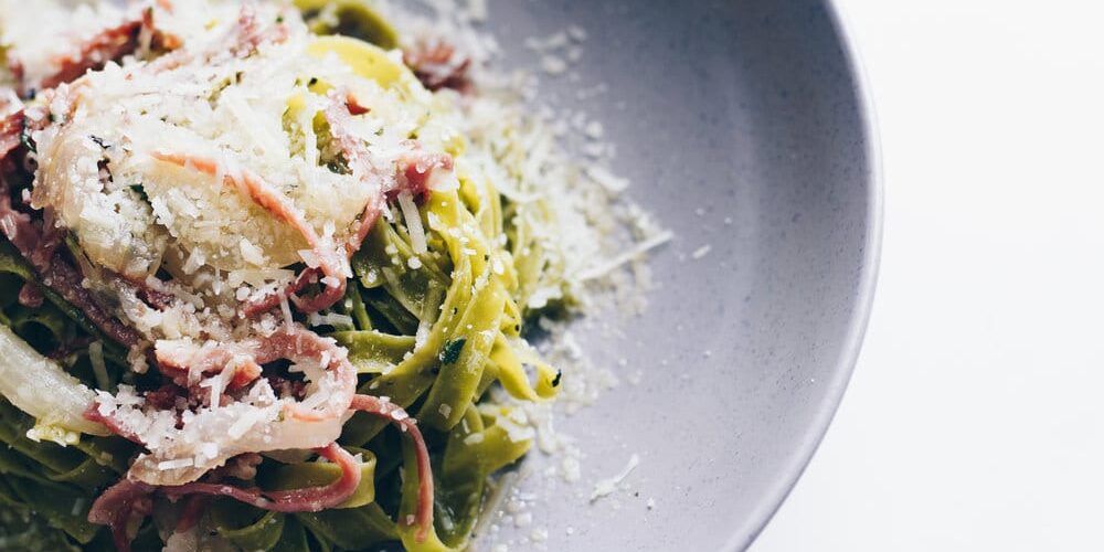 Spinach Egg Tagliatelle with prosciutto, braised onion, thyme and Grana Padano