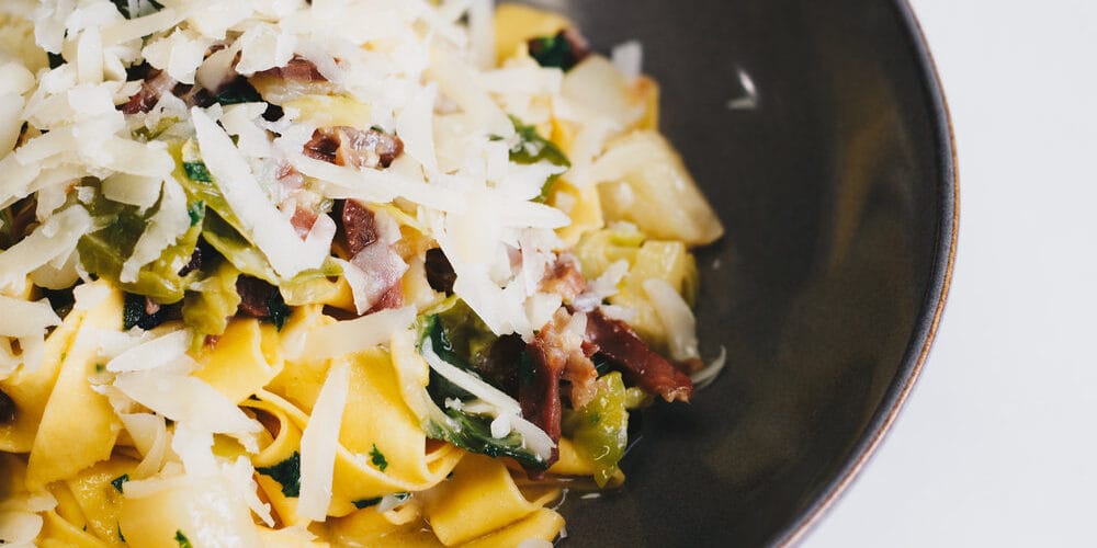 Pappardelle Bertagni “Valtellinese” with bitto cheese, savoy cabbage and prosciutto
