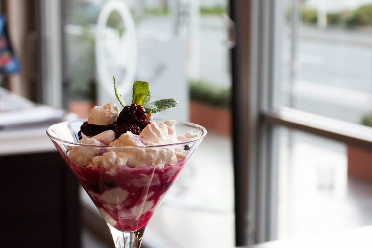 Ricotta Eton Mess with mixed berries in vanilla syrup