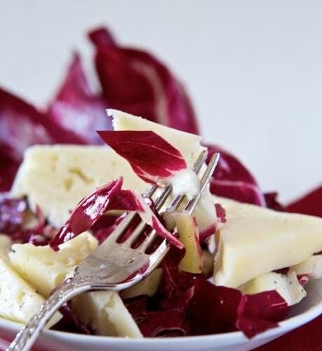 Salad of radicchio Chioggia, curly endive, Asiago cheese and grapes